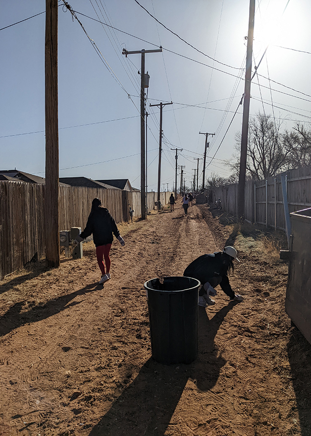 Mandry employees helping clean up trash for Lubbock Habitat for Humanity