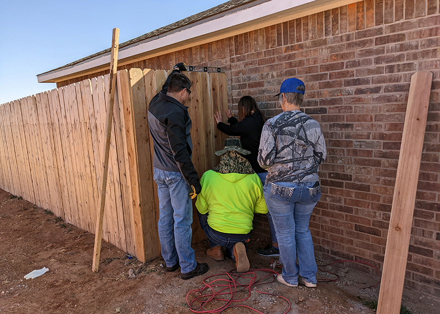Mandry employees helping build fence for Lubbock Habitat for Humanity