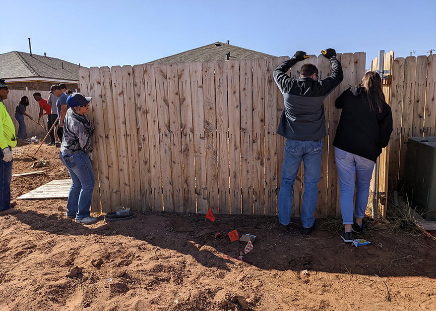 Mandry employees helping build fence for Lubbock Habitat for Humanity